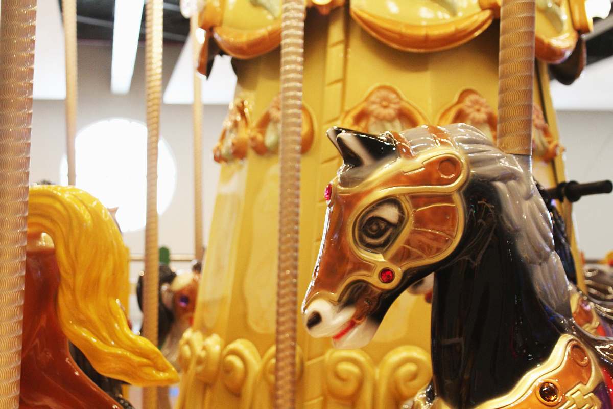 carousel yellow and orange carousel ride theme park